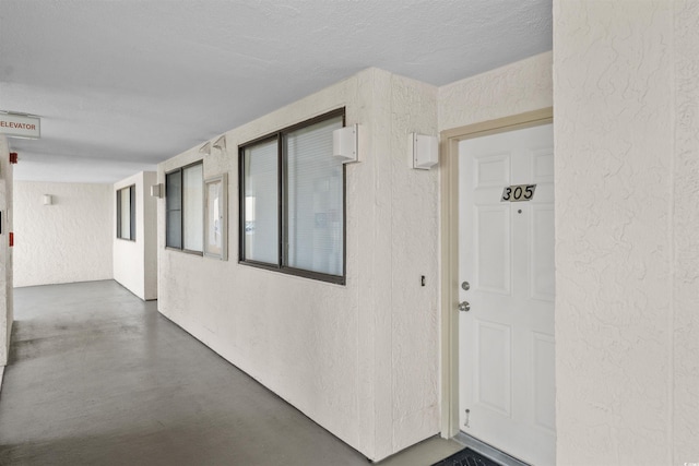 523 S Ocean Blvd Unit 305, North Myrtle Beach, SC 29582 - view of exterior entry with stucco siding