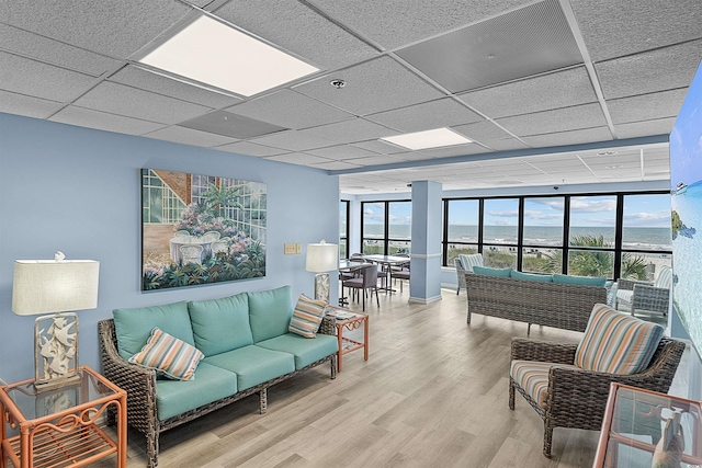 523 S Ocean Blvd Unit 305, North Myrtle Beach, SC 29582 - living area with wood finished floors and a drop ceiling