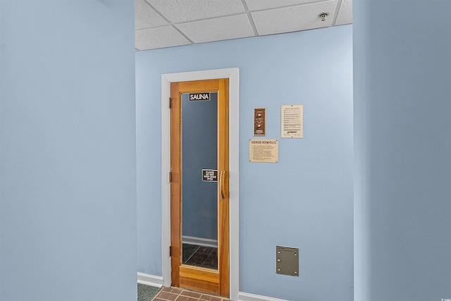 523 S Ocean Blvd Unit 305, North Myrtle Beach, SC 29582 - hallway with a drop ceiling and tile patterned floors