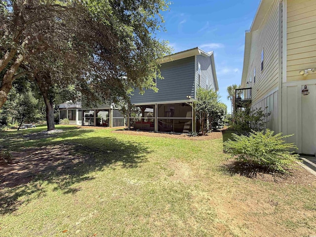 147 Weatherboard Ct, Pawleys Island, SC 29585 - view of grassy yard with a sunroom