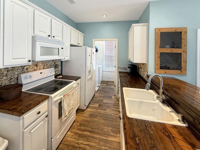 147 Weatherboard Ct, Pawleys Island, SC 29585 - kitchen featuring white appliances, white cabinets, backsplash, independent washer and dryer, and dark wood-type flooring