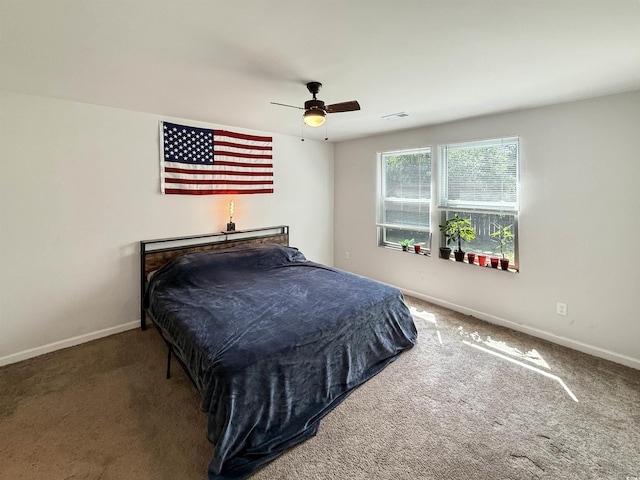 2021 Loblolly St, Georgetown, SC 29440 - carpeted bedroom with baseboards and ceiling fan