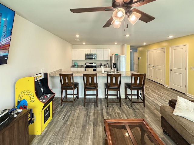 2021 Loblolly St, Georgetown, SC 29440 - dining room featuring dark wood-style flooring, a ceiling fan, and recessed lighting
