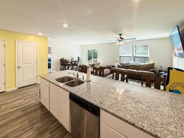 2021 Loblolly St, Georgetown, SC 29440 - kitchen with stainless steel dishwasher, dark wood-style floors, light stone countertops, white cabinetry, and a ceiling fan