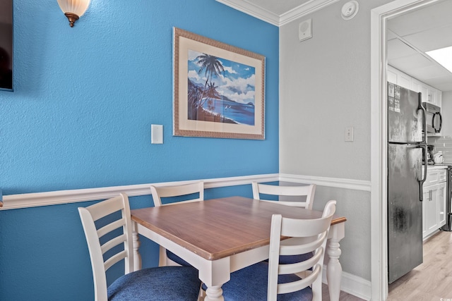 3000 N Ocean Blvd N Unit 1532, Myrtle Beach, SC 29577 - dining room with a textured wall, ornamental molding, and light wood-style floors