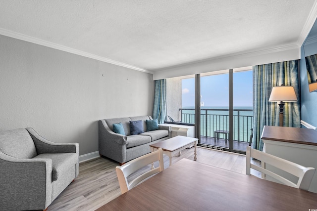 3000 N Ocean Blvd N Unit 1532, Myrtle Beach, SC 29577 - living room with a textured ceiling, ornamental molding, a water view, and wood finished floors
