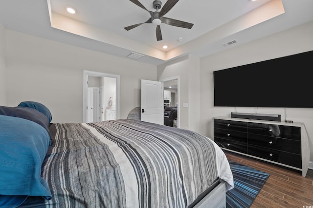 2212 Leeboard Ct, Myrtle Beach, SC 29579 - bedroom with a tray ceiling, dark wood finished floors, recessed lighting, and ceiling fan