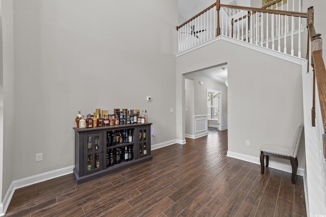 2212 Leeboard Ct, Myrtle Beach, SC 29579 - entrance foyer featuring wood finished floors, a bar, stairway, and a high ceiling