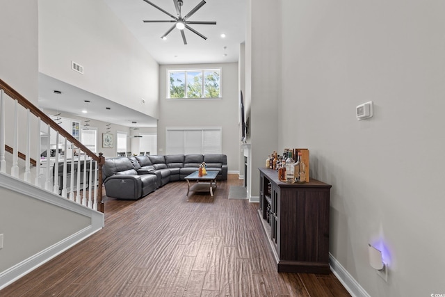 2212 Leeboard Ct, Myrtle Beach, SC 29579 - living room with stairs, wood finished floors, a towering ceiling, and a ceiling fan