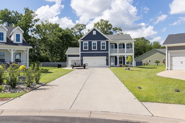 2212 Leeboard Ct, Myrtle Beach, SC 29579 - view of front facade with board and batten siding, concrete driveway, a balcony, an attached garage, and a porch