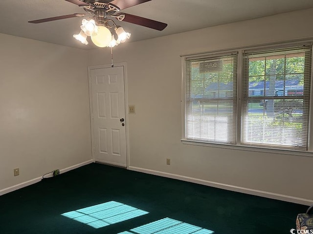 4041 Long Line Ln, Myrtle Beach, SC 29579 - unfurnished room featuring dark carpet, a ceiling fan, and healthy amount of natural light