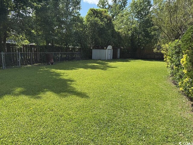4041 Long Line Ln, Myrtle Beach, SC 29579 - fenced backyard featuring a storage unit
