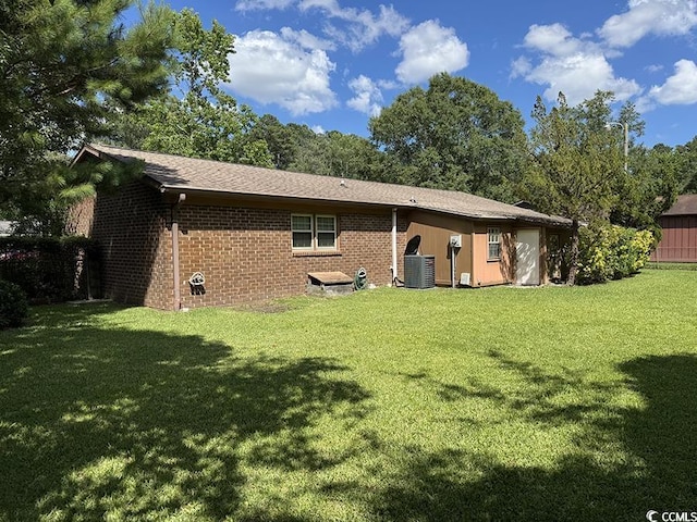 4041 Long Line Ln, Myrtle Beach, SC 29579 - rear view of property featuring a yard and brick siding