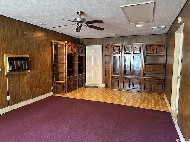 4041 Long Line Ln, Myrtle Beach, SC 29579 - carpeted foyer entrance featuring wooden walls, ceiling fan, a wall mounted air conditioner, and a textured ceiling