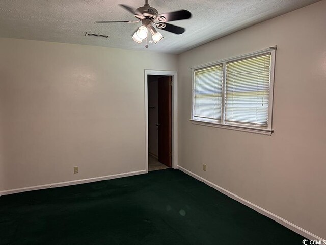 4041 Long Line Ln, Myrtle Beach, SC 29579 - empty room featuring ceiling fan, a textured ceiling, and dark colored carpet