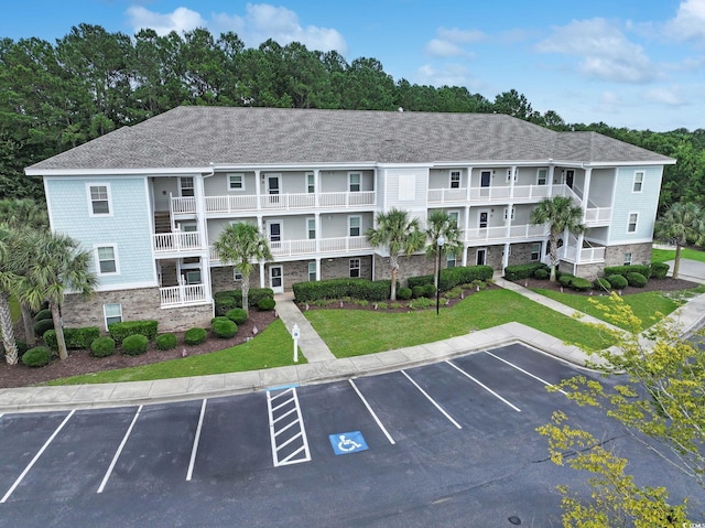6253 Catalina Dr Unit 1711, North Myrtle Beach, SC 29582 - view of property featuring uncovered parking