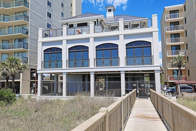 6253 Catalina Dr Unit 1711, North Myrtle Beach, SC 29582 - rear view of property with a standing seam roof, a metal roof, and a balcony