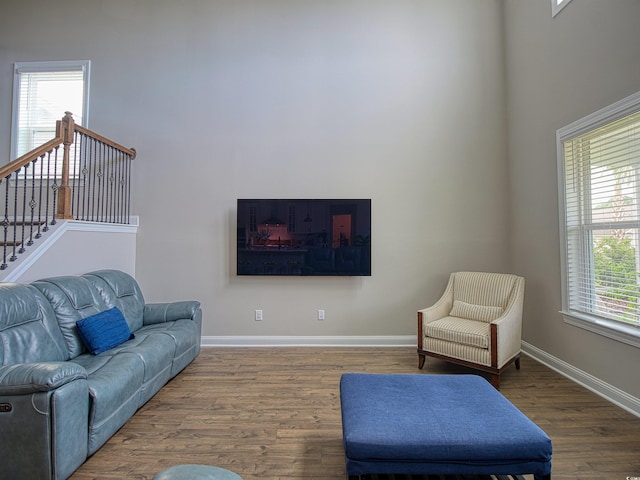 376 Mikita Dr, Surfside Beach, SC 29575 - living area with wood finished floors, a towering ceiling, and stairs