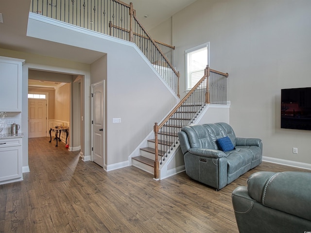 376 Mikita Dr, Surfside Beach, SC 29575 - living room with stairway, a towering ceiling, and wood finished floors