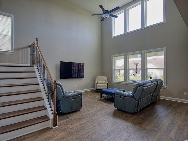 376 Mikita Dr, Surfside Beach, SC 29575 - living area featuring dark wood-style floors, a ceiling fan, a towering ceiling, and stairway