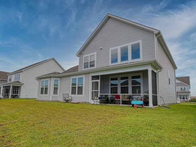 376 Mikita Dr, Surfside Beach, SC 29575 - rear view of house featuring a lawn