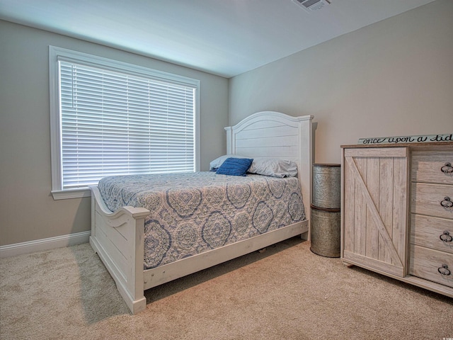 376 Mikita Dr, Surfside Beach, SC 29575 - bedroom featuring light colored carpet and multiple windows