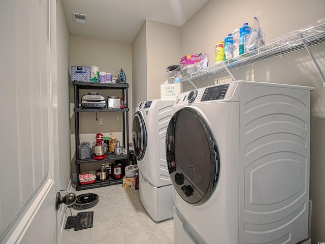 376 Mikita Dr, Surfside Beach, SC 29575 - laundry area featuring washer and clothes dryer and light tile patterned flooring