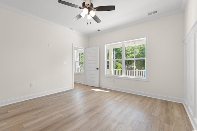 2428 Park St, North Myrtle Beach, SC 29582 - unfurnished room with crown molding, a ceiling fan, and light wood-style floors