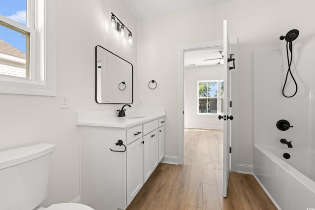 2428 Park St, North Myrtle Beach, SC 29582 - full bath featuring vanity, wood finished floors, and washtub / shower combination