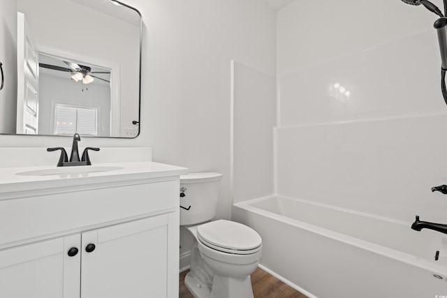 2428 Park St, North Myrtle Beach, SC 29582 - full bath with wood finished floors, vanity, ceiling fan, and washtub / shower combination