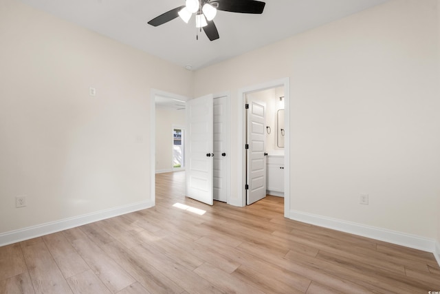 2428 Park St, North Myrtle Beach, SC 29582 - unfurnished bedroom featuring light wood-style flooring, connected bathroom, and ceiling fan