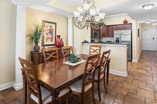 100 N Beach Blvd Unit 1816, North Myrtle Beach, SC 29582 - dining space featuring a chandelier, stone tile floors, and ornate columns