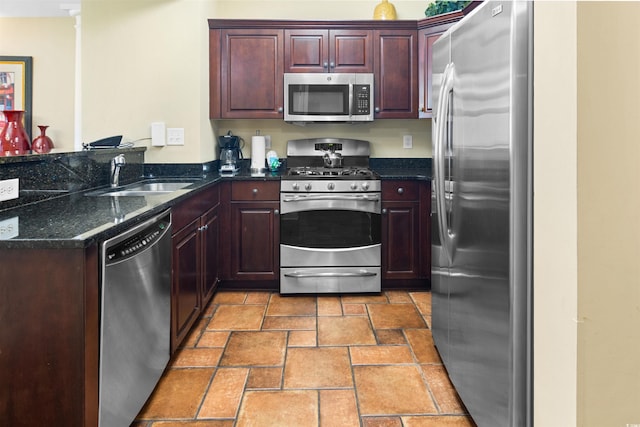 100 N Beach Blvd Unit 1816, North Myrtle Beach, SC 29582 - kitchen featuring stainless steel appliances, stone tile floors, dark stone countertops, and a peninsula