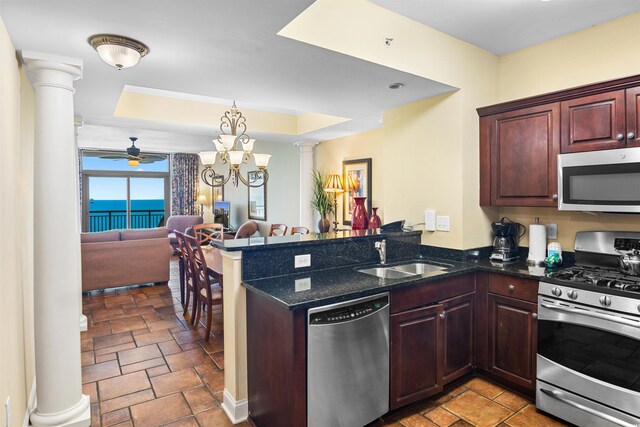 100 N Beach Blvd Unit 1816, North Myrtle Beach, SC 29582 - kitchen with appliances with stainless steel finishes, decorative columns, a tray ceiling, and ceiling fan