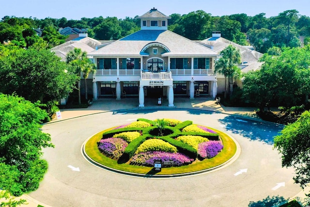 100 N Beach Blvd Unit 1816, North Myrtle Beach, SC 29582 - view of front facade with curved driveway, a carport, and a balcony