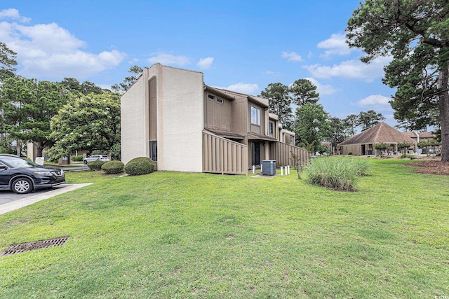 800 Egret Cir Unit 53, Little River, SC 29566 - view of property exterior with a lawn and stucco siding