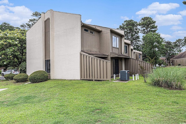 800 Egret Cir Unit 53, Little River, SC 29566 - view of side of home with a lawn and a central air condition unit