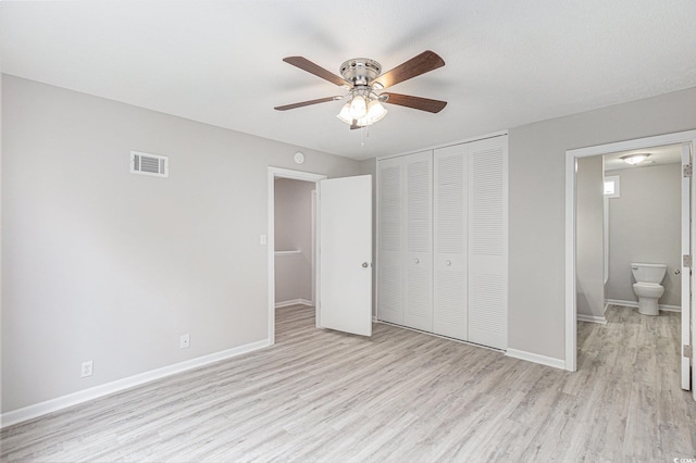 800 Egret Cir Unit 53, Little River, SC 29566 - unfurnished bedroom with light wood-style floors, a closet, and a ceiling fan