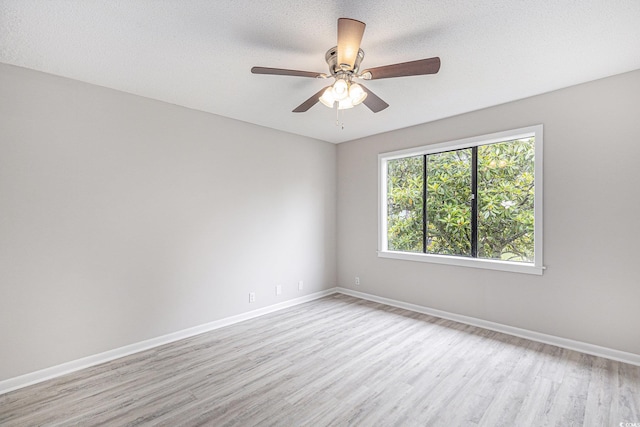 800 Egret Cir Unit 53, Little River, SC 29566 - unfurnished room featuring light wood-type flooring, a ceiling fan, and a textured ceiling