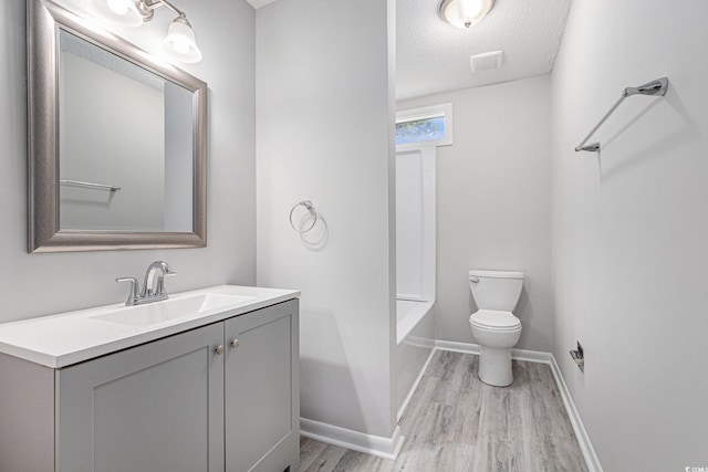 800 Egret Cir Unit 53, Little River, SC 29566 - full bathroom featuring wood finished floors, vanity, and a textured ceiling