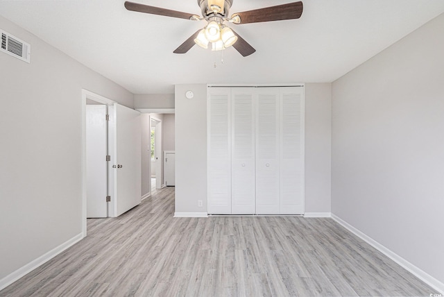 800 Egret Cir Unit 53, Little River, SC 29566 - unfurnished bedroom with light wood-style flooring, a closet, and ceiling fan