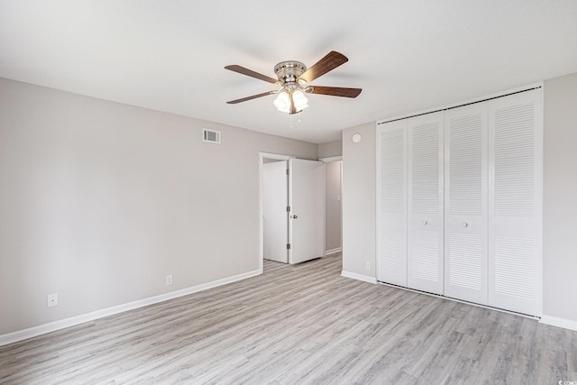800 Egret Cir Unit 53, Little River, SC 29566 - unfurnished bedroom with light wood-type flooring, a closet, and ceiling fan