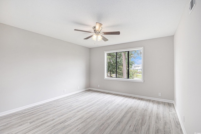 800 Egret Cir Unit 53, Little River, SC 29566 - unfurnished room with light wood-style flooring, a ceiling fan, and a textured ceiling