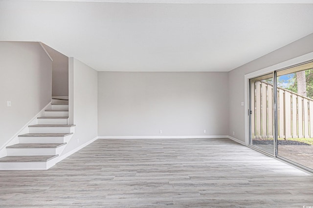 800 Egret Cir Unit 53, Little River, SC 29566 - unfurnished room featuring light wood finished floors and stairs