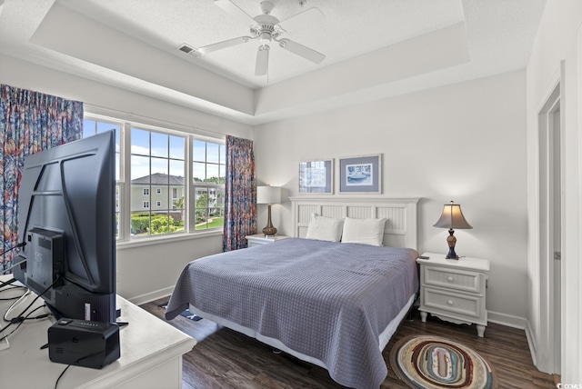 5801 Oyster Catcher Dr Unit 431, North Myrtle Beach, SC 29582 - bedroom featuring a raised ceiling, dark wood finished floors, and a ceiling fan