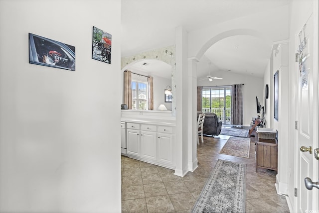 5801 Oyster Catcher Dr Unit 431, North Myrtle Beach, SC 29582 - hall with arched walkways, lofted ceiling, and light tile patterned floors