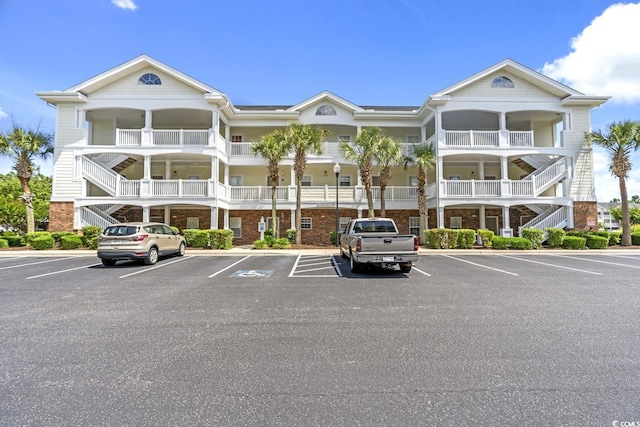 5801 Oyster Catcher Dr Unit 431, North Myrtle Beach, SC 29582 - view of property featuring uncovered parking and stairs