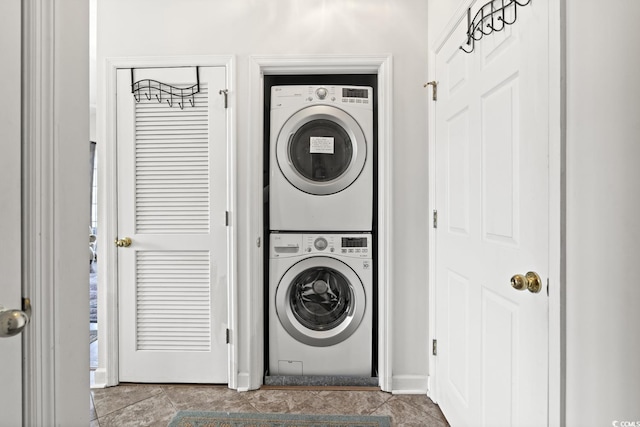 5801 Oyster Catcher Dr Unit 431, North Myrtle Beach, SC 29582 - laundry area featuring stacked washing machine and dryer and baseboards