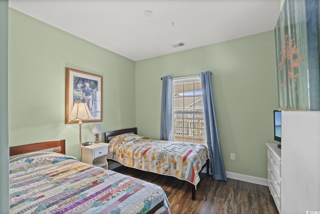 5801 Oyster Catcher Dr Unit 431, North Myrtle Beach, SC 29582 - bedroom featuring dark wood-style flooring and baseboards