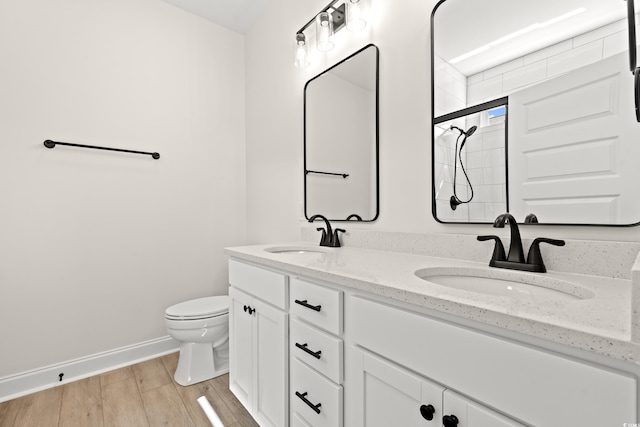 2426 Park St, North Myrtle Beach, SC 29582 - bathroom with double vanity, wood finished floors, and a tile shower